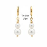 Aros huggies perlas blancas.